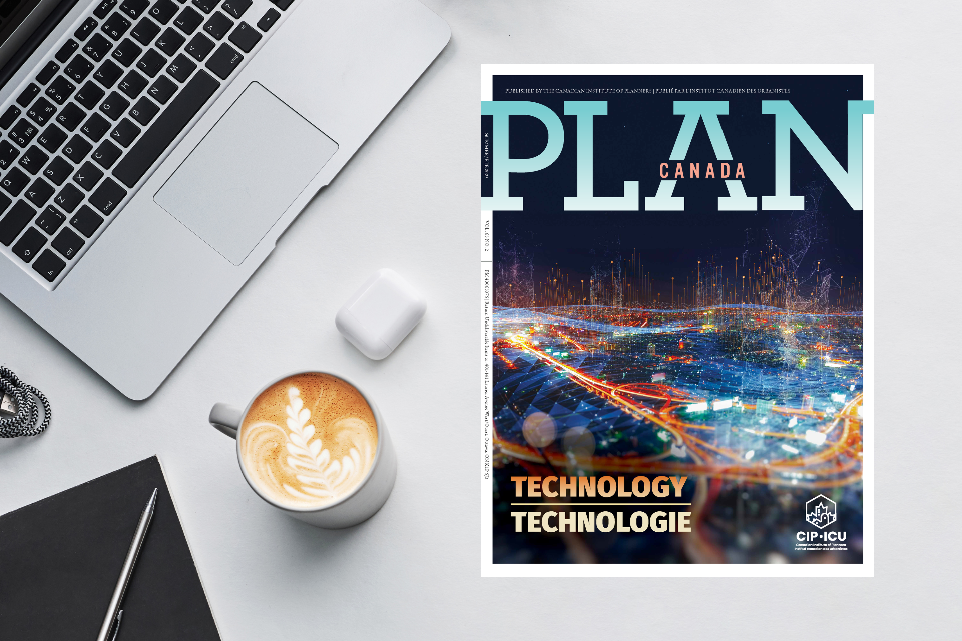 magazine on a desk next to a laptop, coffee mug, and airpods case.